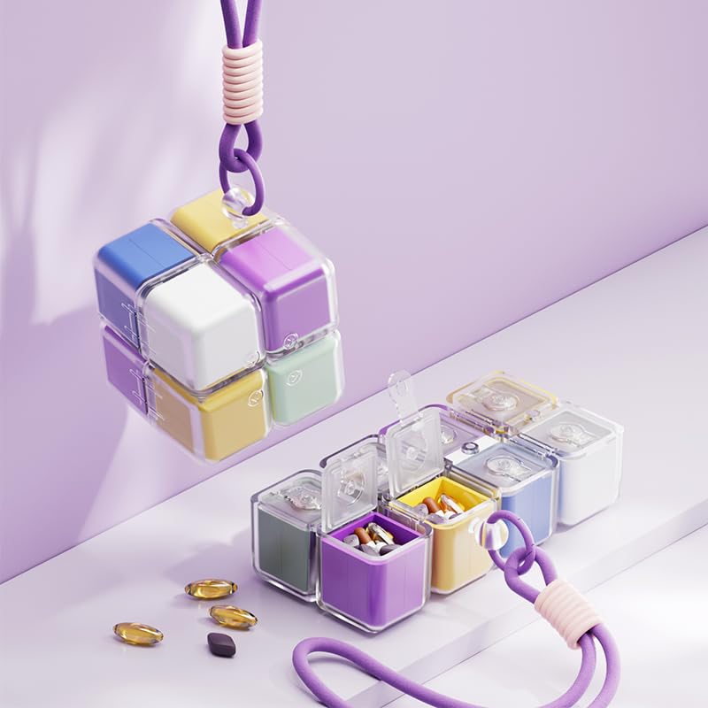 Pill organizer cube hanging and opened in a row