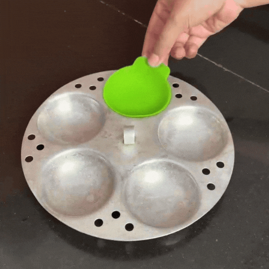 Silicone Idli Liners fitting inside metal idli plate cavities